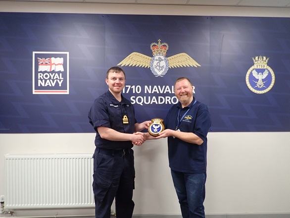 Dave Smith receives a memento of his time at 1710 from Lt Cdr Tom Eeles