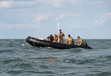 Sailors assigned to Explosive Ordnance Disposal Mobile Unit 2 prepare to retrieve a Mark 18 Mod I unmanned underwater vehicle