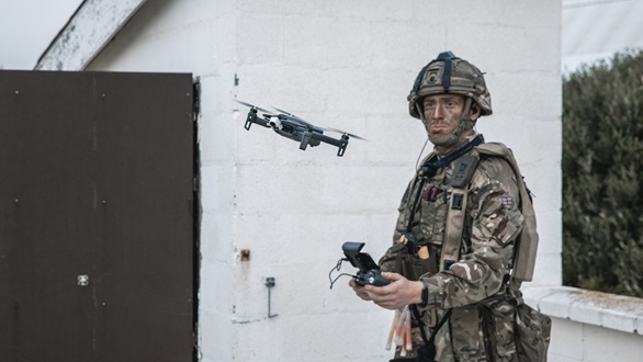 A Royal Marine launches a reconnaissance drone on the Rock