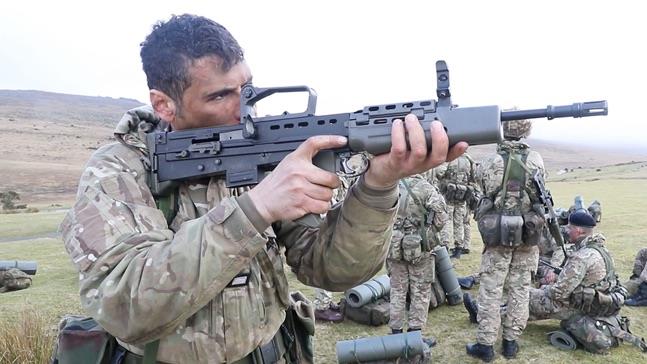 Why reserves video still image with camo-dressed RNRs on weapons training sortie