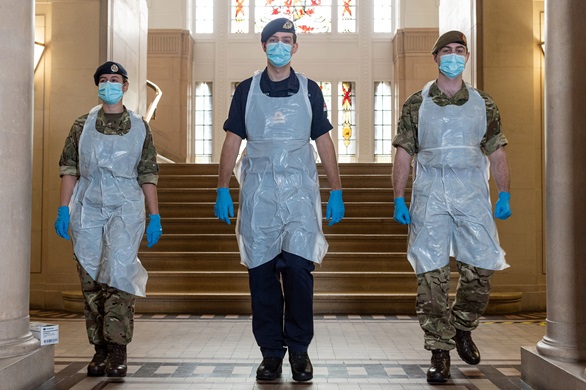 Lt Kevin Cabra Netherton (centre) with Reservist colleagues in PPE testing gear in Trafford Town Hall